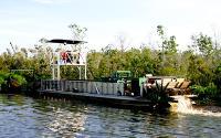 Mechanical harvester in a canal